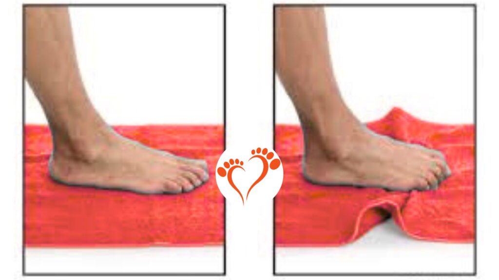 athlete performing toe towel curls to strengthen foot muscles on wooden floor